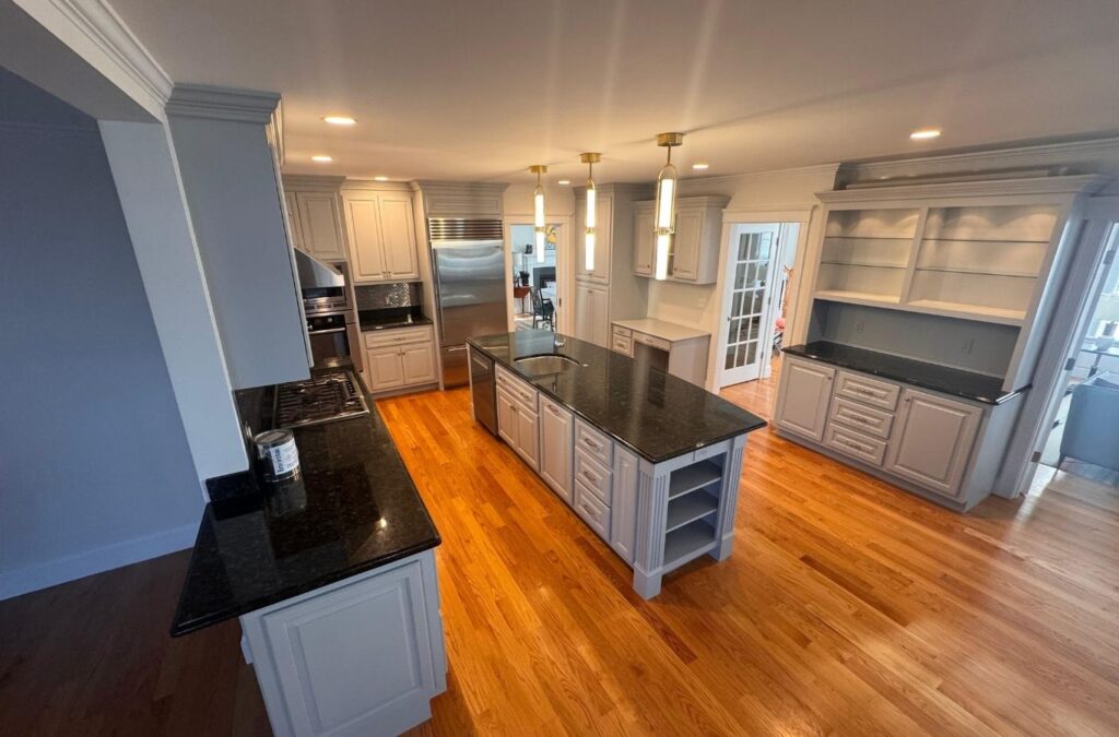 Newly painted Auburn dining room with smooth walls and neatly covered furniture