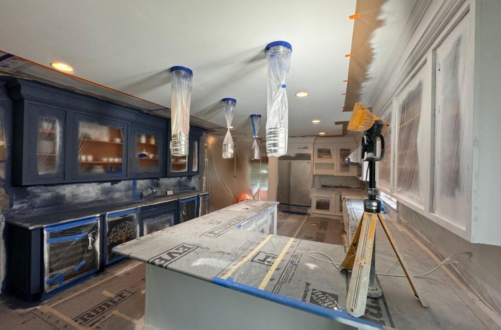 Skilled painter rolling even coat across repaired interior wall surface. Interior Painting near me.