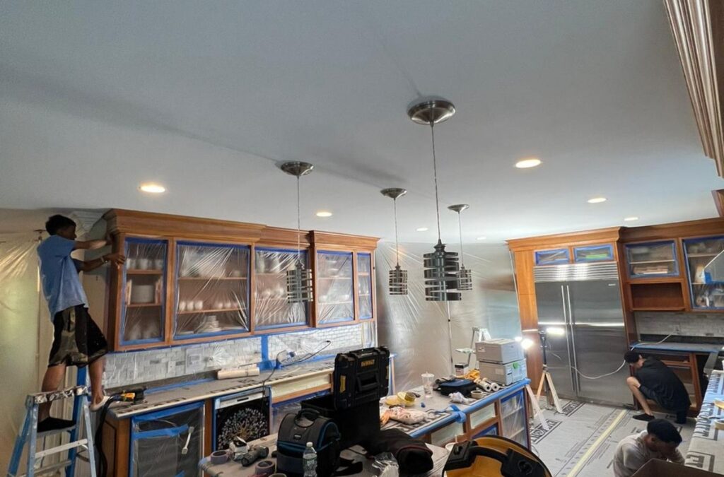 Freshly painted Shrewsbury living room with protected furniture and crisp wall edges