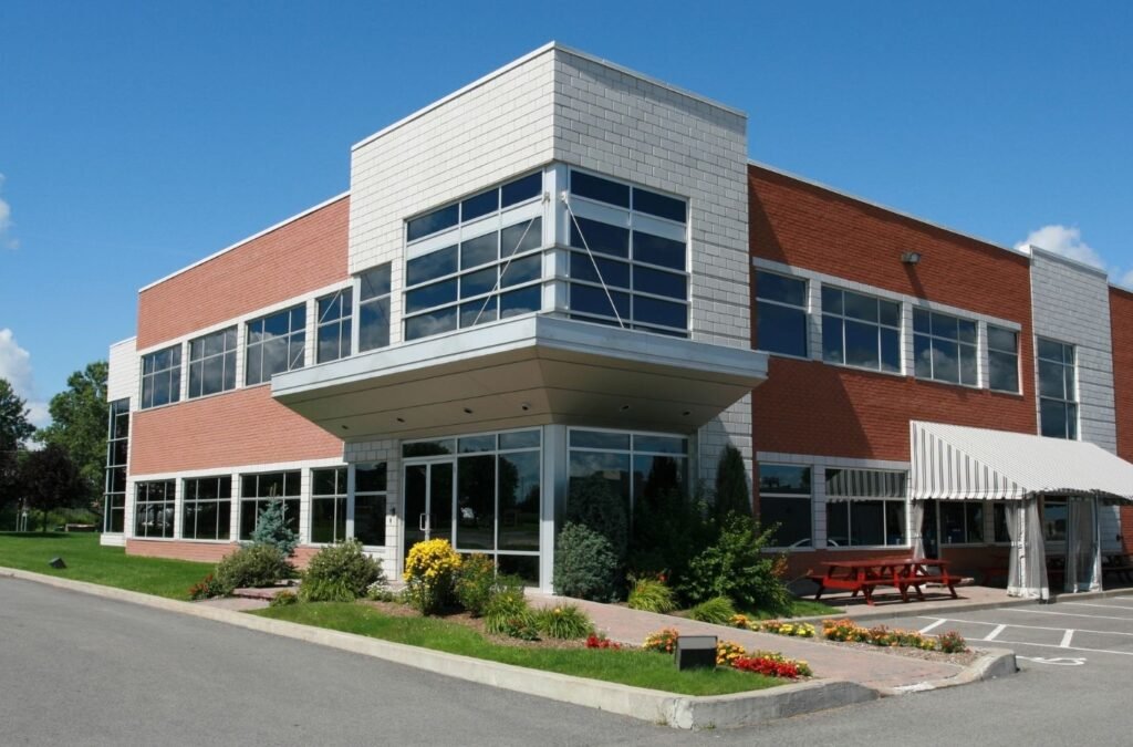 Brick office with a glass entry, for Lucena Painting commercial painting in Auburn, MA. Commercial Painting Near Me.